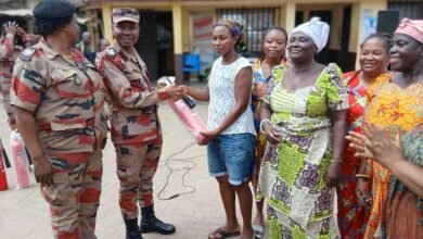 ACFO Darko( second from left) presenting a fire extinguisher to the Apremdo team