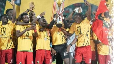 Flashback Asante Kotoko players celebrating with last season's trophy