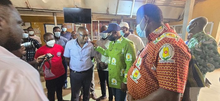 Dr KabaAkoriyea (middle) interacting with some scientists during their meeting