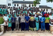 Mrs Maame Efua Houadjeto (middle) with officials from the Authority, students and teachers of the School after the event