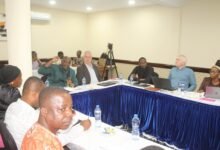 Mr Peter Dery (with mic) addressing participants at the meeting. Photo. Ebo Gorman