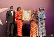 Joyce Bawa Mongtari (second from left) presenting the citation to one of the awardees