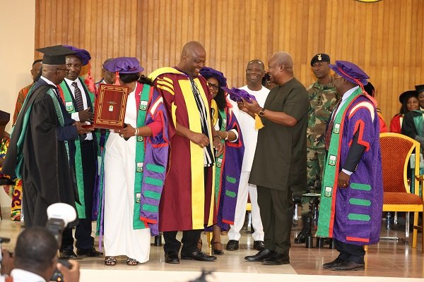 President Mahama (infront) about to honour Ibrahim Mahama with the honorary degree