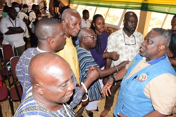 • Mr Allotey-Gaisie (right) interacting with some elders of Osu after the media briefing Photo: Seth Osabukle
