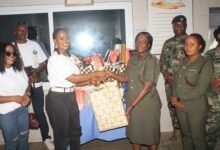 Ms Adepa Amissah (third from left) presenting the items to Lt Col Oppong. Photo. Ebo Gorman