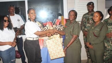 Ms Adepa Amissah (third from left) presenting the items to Lt Col Oppong. Photo. Ebo Gorman
