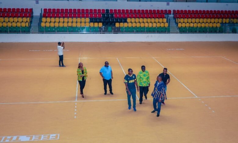 • Members of the LOC on one of the courts at the facility