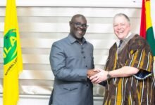 Mr Mohammed Abdul-Salam (left) welcoming Mr Andreas Kotter into his office