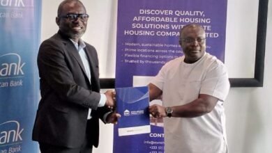 • Mr Squire (left) exchanging the MoU document with Mr Quaye