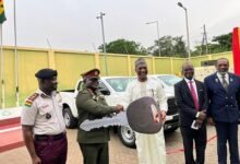 Mr Muntaka Mohammed-Mubarak (middle) handing over the vehicles to Brigadier General Maxwell Obuba Mantey (second from left)