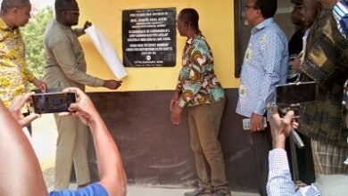 Mr Awal Joseph Antwi (left) and Mr Geoffrey Kini unveiling a plaque to inaugurate the new classroom block