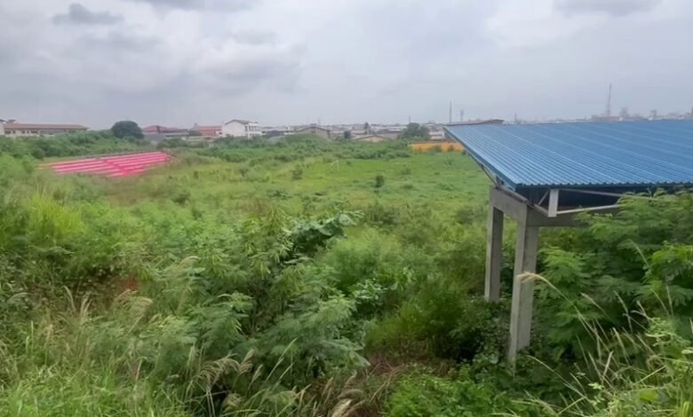 Portions of the Azumah Nelson Sports Complex overgrown by weeds