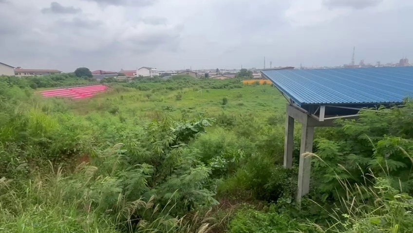 Portions of the Azumah Nelson Sports Complex overgrown by weeds
