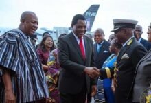 President Hichilema (middle) exchanging pleasantries with some dignitaries. With them is President Mahama (left)