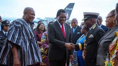 President Hichilema (middle) exchanging pleasantries with some dignitaries. With them is President Mahama (left)