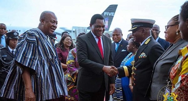 President Hichilema (middle) exchanging pleasantries with some dignitaries. With them is President Mahama (left)