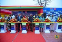 President Mahama (middle), Mr Shen Yanchang (third from left), Mrs Elizabeth Ofosu-Adjare (third from right) and others jointly cutting the tape for construction of the glass factory