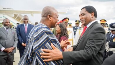 -President Mahama (in smock) being welcomed by President Hakainde Hichilema of Zambia