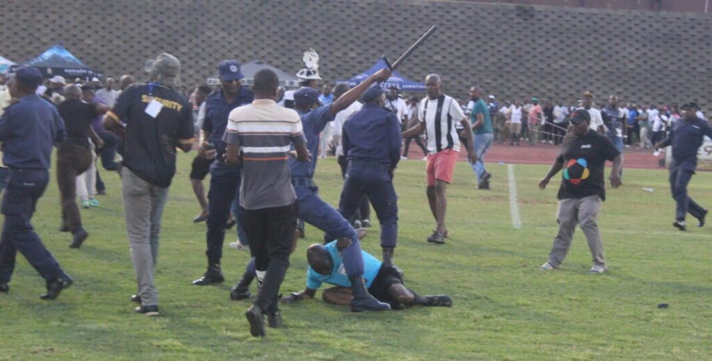 Referee Masixole Bambiso under attack from fans