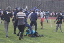 Referee Masixole Bambiso under attack from fans