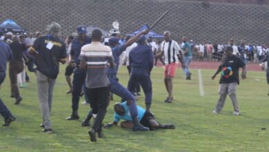Referee Masixole Bambiso under attack from fans