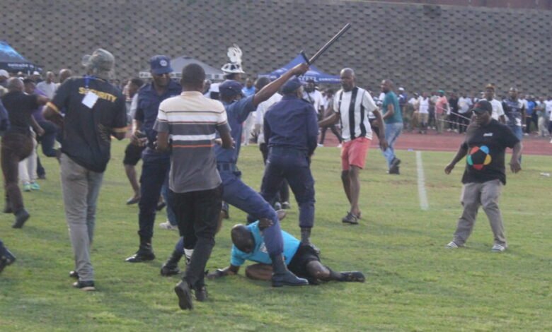 Referee Masixole Bambiso under attack from fans