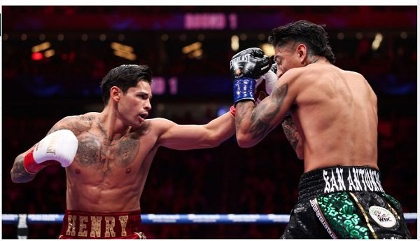 Ryan Garcia throws a punch at Mario Barrios during their WBC welterweight title fight at T-Mobile Arena in Las Vegas on Saturday.
