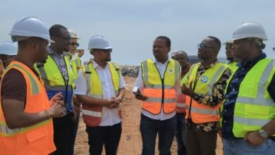 Mr Adjei (right) being briefed about the ongoing project