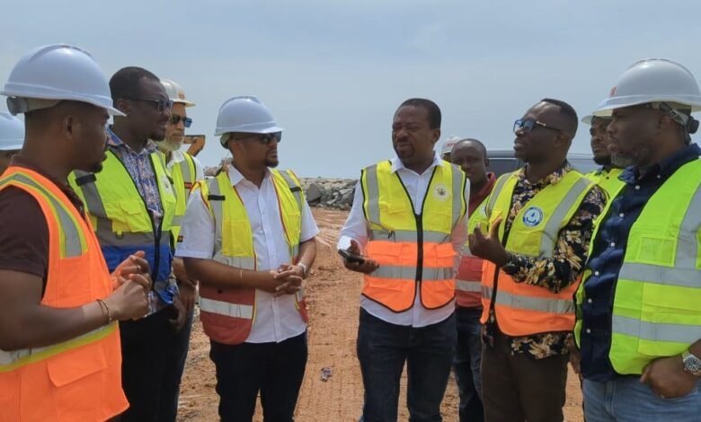 Mr Adjei (right) being briefed about the ongoing project