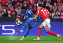 Vini Jr unleashes a pearler of a curler past Benfica’s Amar Dedic to put the visitors ahead