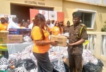 • Ms Philippine Gordor (left) presenting the items to Chief Supt Mr Isaac Boakye