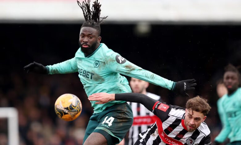 Wolves’ Tolu Arokodare in action with Grimsby Town's Jamie Walker