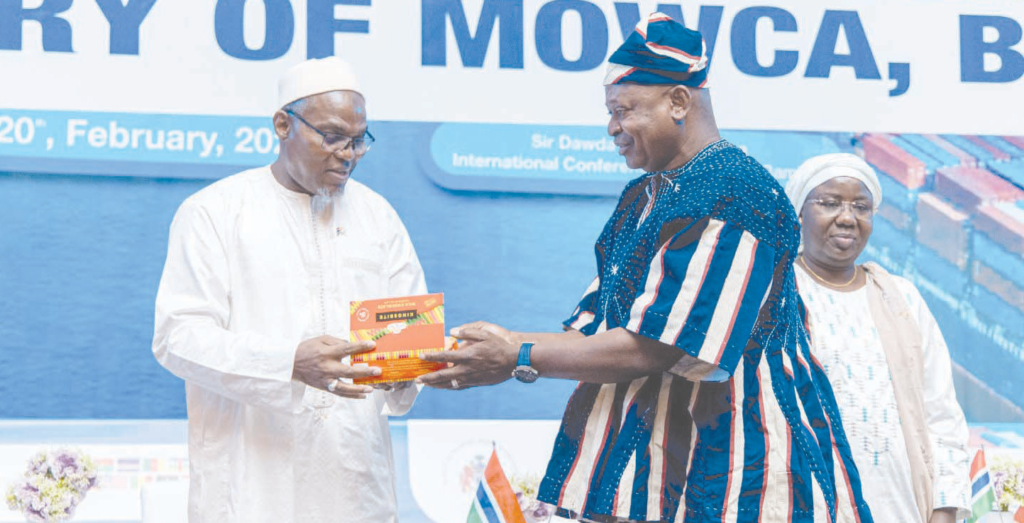 • Mohammed Jallow (left),Vice President of the Gambia receiving a chocolate package from Mr Nikpe