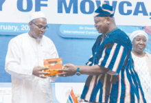 • Mohammed Jallow (left),Vice President of the Gambia receiving a chocolate package from Mr Nikpe