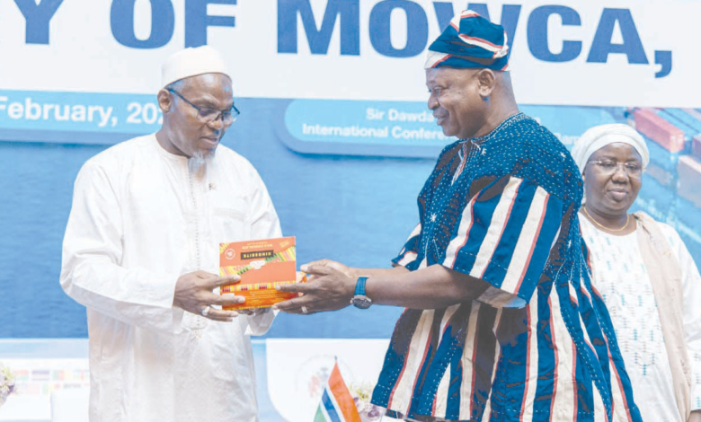 • Mohammed Jallow (left),Vice President of the Gambia receiving a chocolate package from Mr Nikpe