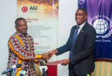 • Mr LaCroix (right) exchanging the MoU document with Mr Akwaboah