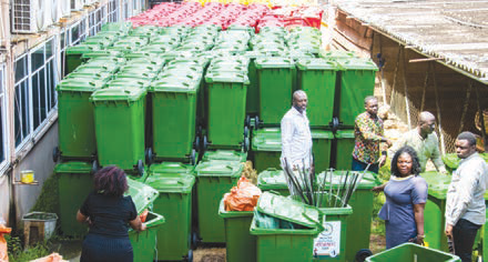 Ms Rita Naa Odoley Sowah (sixth from left) symbolically handing over the items to Ms Linda Ocloo