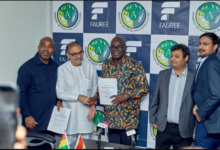 Mr Sib Ali, (second from left), Fauree Link Ghana Limited Board Chairman, exchanging the Agreement document with Mr Eric Opoku (middle), Minister of Food and Agriculture