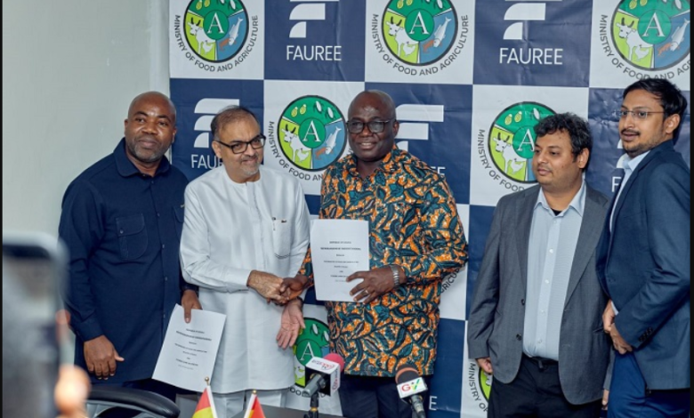 Mr Sib Ali, (second from left), Fauree Link Ghana Limited Board Chairman, exchanging the Agreement document with Mr Eric Opoku (middle), Minister of Food and Agriculture