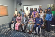 • Professor Gatsi (seated third from right) with the Board Members and the technical of cers of the Energy Commission