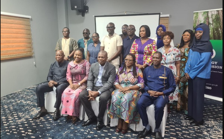 • Professor Gatsi (seated third from right) with the Board Members and the technical of cers of the Energy Commission