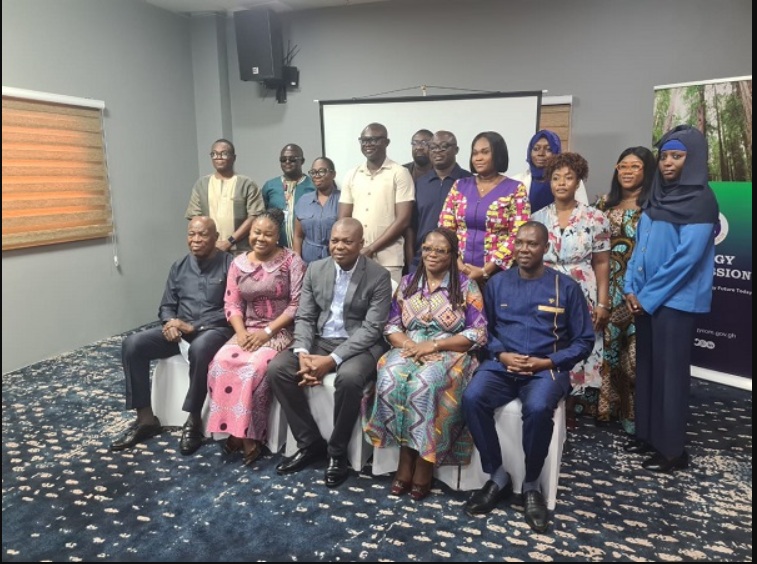 • Professor Gatsi (seated third from right) with the Board Members and the technical of cers of the Energy Commission