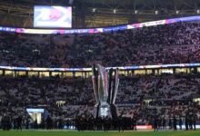 A giant AFC Asian Cup trophy is displayed inside the stadium before the match