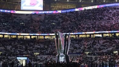 A giant AFC Asian Cup trophy is displayed inside the stadium before the match