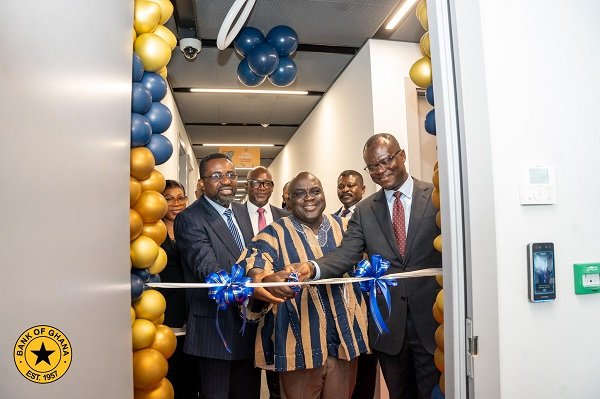 The Chief of Staff, Julius Debrah (middle) being assisted by Dr Asiama (left) and Dr Zakari (right) inagurate the CISD office