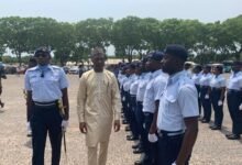 -Mohammed Muntaka (middle) inspecting a guard of honour at the ceremony