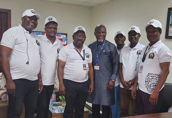 Dr Oduro Arhin Jnr (right) with other members at the programme