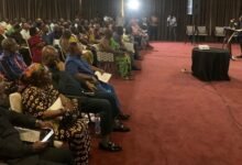 Mr Madjie (inset) addressing the participants