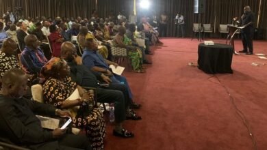 Mr Madjie (inset) addressing the participants