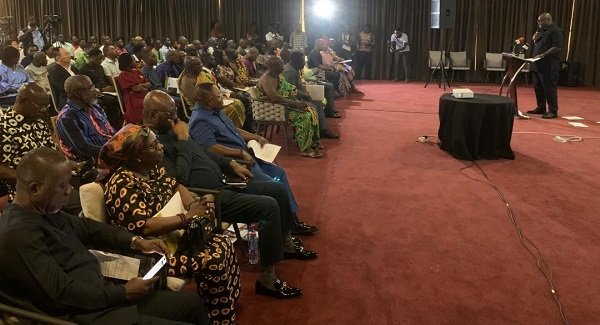 Mr Madjie (inset) addressing the participants